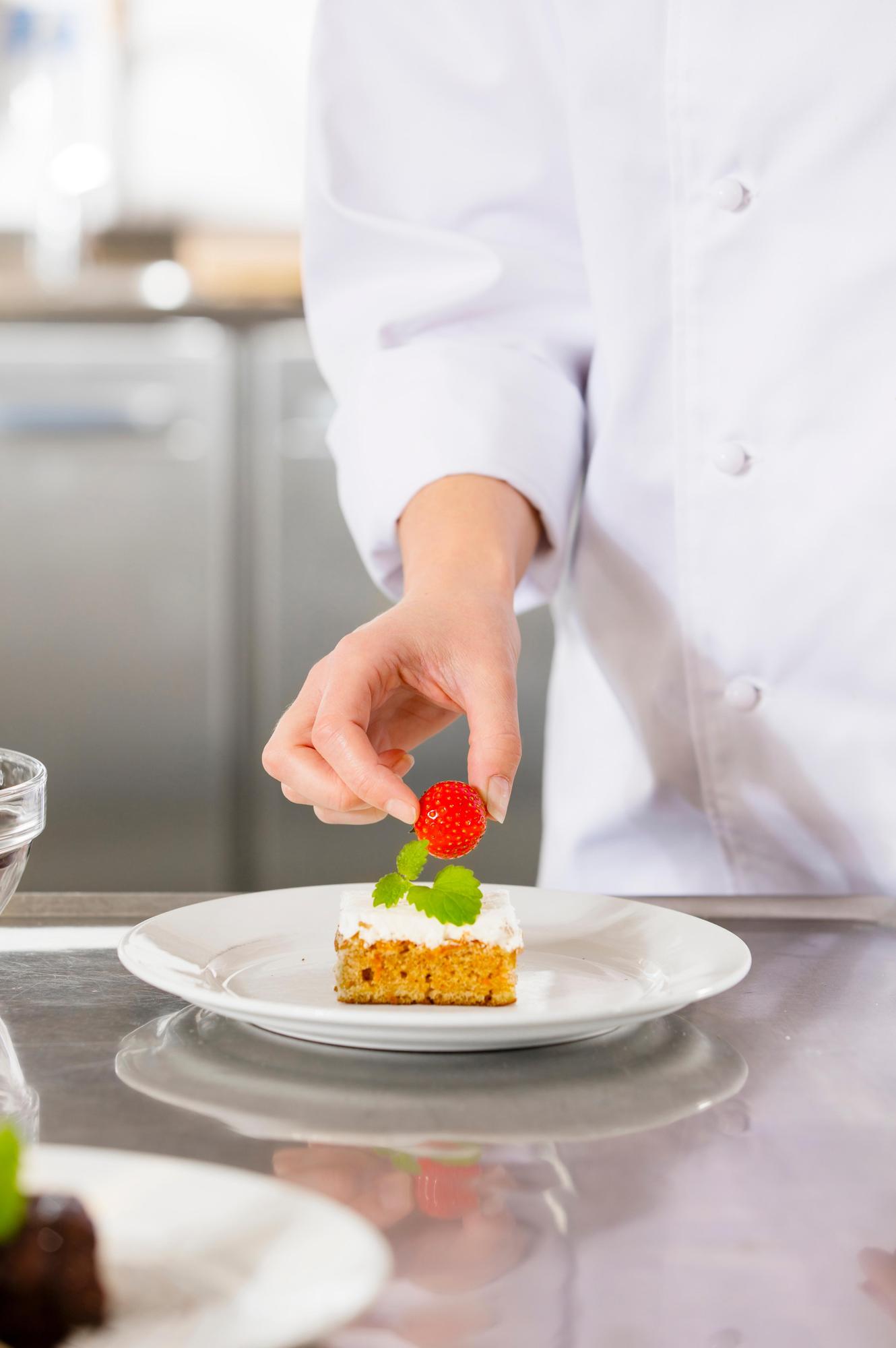 Head chef with plated dessert